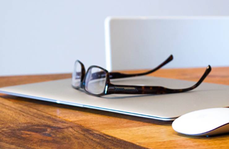 a laptop and glasses